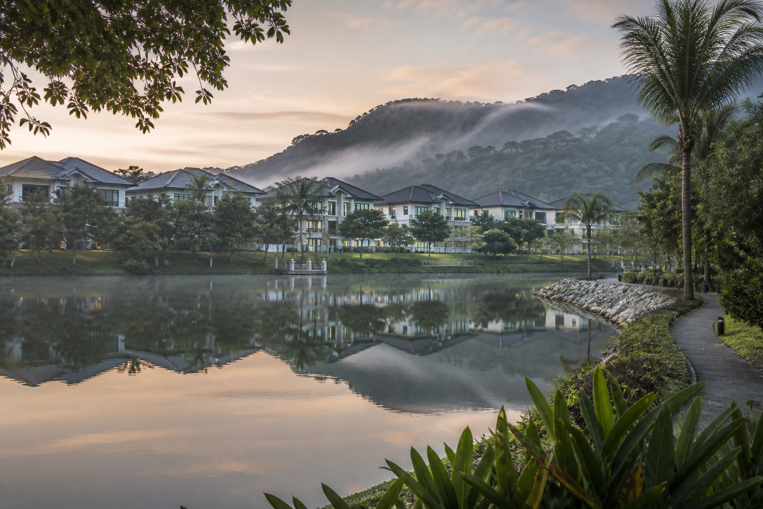 Eco Park homes and a waterside landscape at blue hour